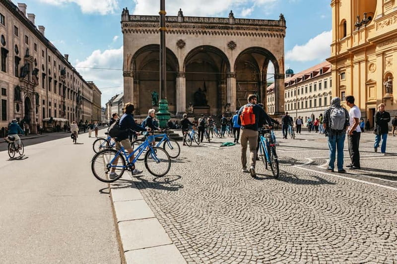 Munich: Classic Guided City Tour by Bike (English Tour Only) - Riding through Residenz courtyards, the feeling of power up close