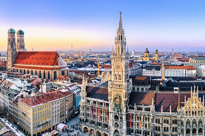 The Neues Rathaus and the Frauenkirche towers over Marienplatz at dusk